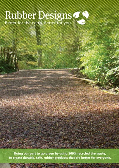 A road with many leaves on it and trees