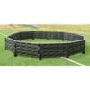 Here's an 8-word alt tag for the image: Black plastic outdoor gaga ball pit on grass.
