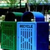 Green trash can, blue recycling bin.