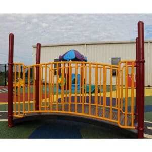 Playground bridge with colorful railings.