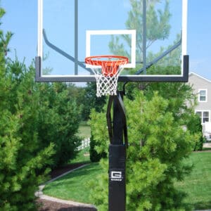 Outdoor basketball hoop with glass backboard.