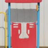 Red children's play structure with roof.